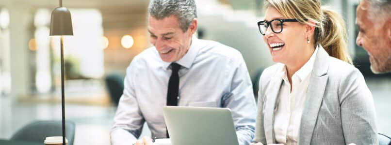 professionals laughing while at meeting